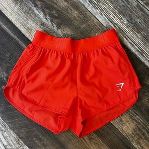 coral gymshark shorts, rubber waistband, size xs